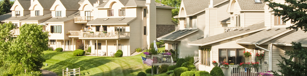 View of homes surrounding green area